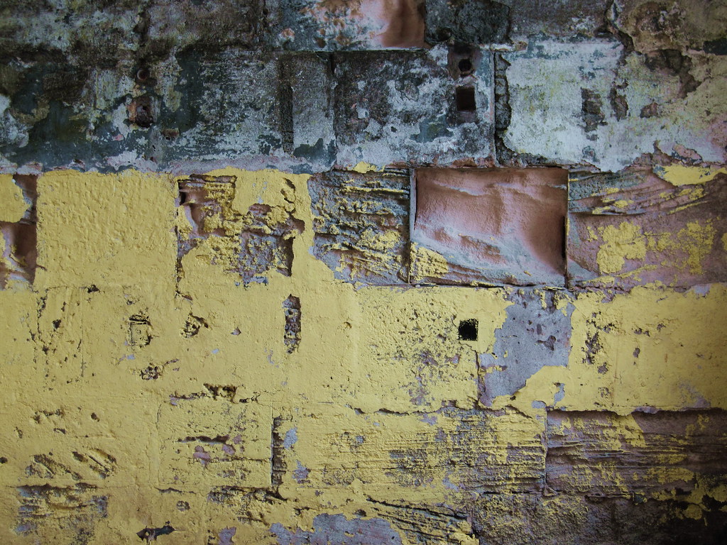 Scraping and removal of loose, damaged, or peeling paint.
