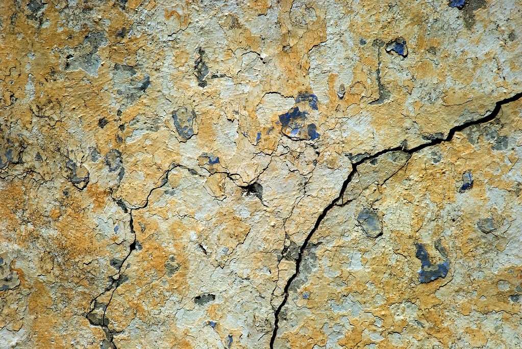 Crack repairs, surface levelling, and preparation for painting.